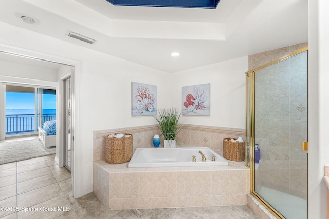 bathroom with tile patterned flooring and plus walk in shower