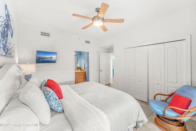 carpeted bedroom featuring ceiling fan and a closet