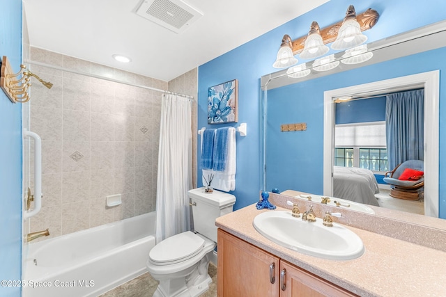 full bathroom with shower / tub combo with curtain, vanity, and toilet