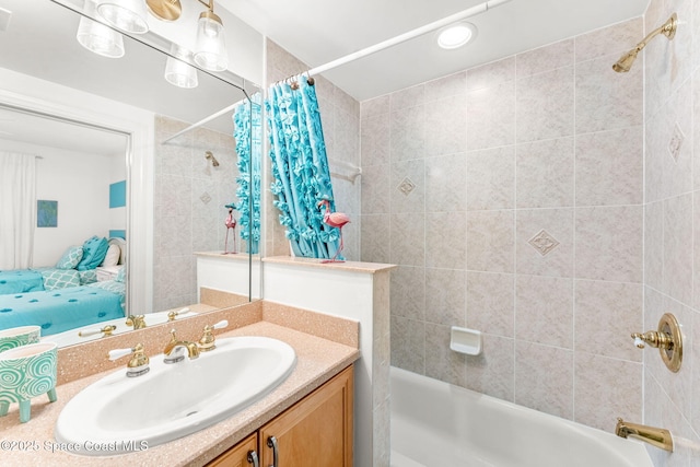 bathroom with vanity and shower / bath combo with shower curtain