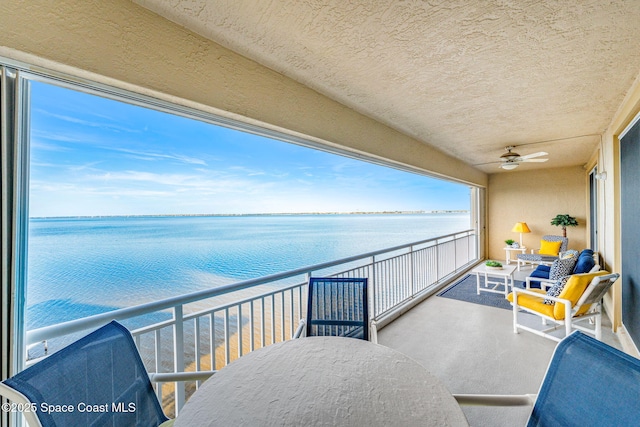 balcony featuring a water view