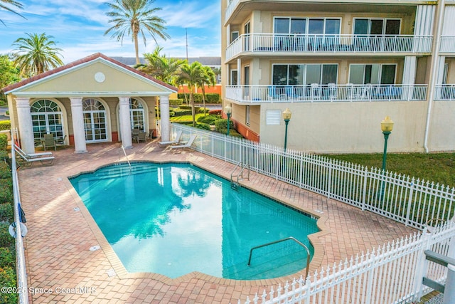 view of swimming pool with a patio