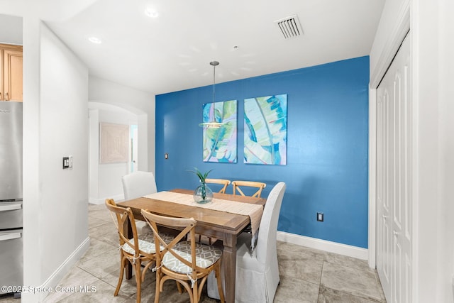 dining space with light tile patterned floors