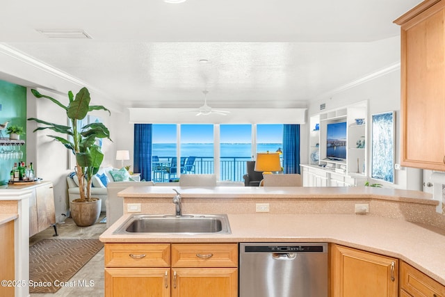 kitchen with ornamental molding, sink, stainless steel dishwasher, and ceiling fan