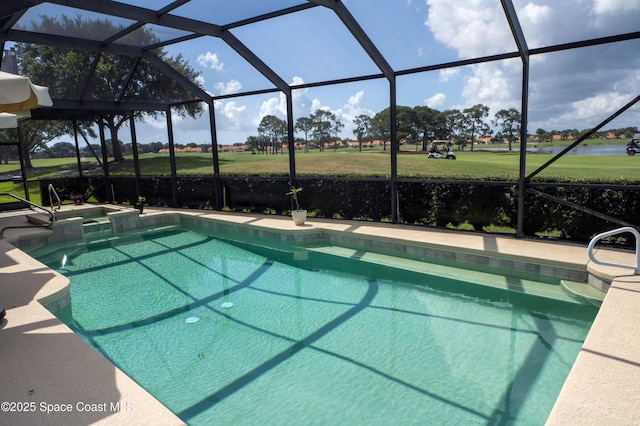 view of swimming pool featuring glass enclosure