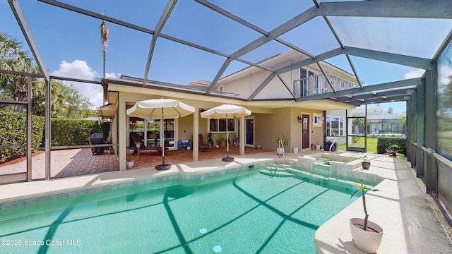 view of swimming pool with a lanai, a hot tub, and a patio