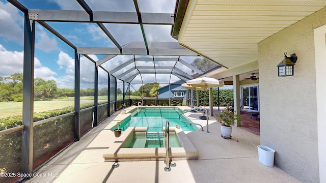 view of swimming pool featuring an in ground hot tub, a patio area, and glass enclosure