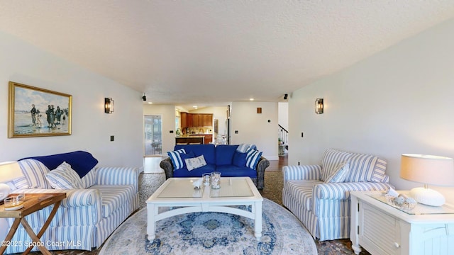 living room with a textured ceiling