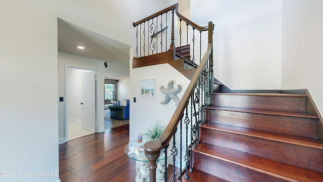 stairway with wood-type flooring