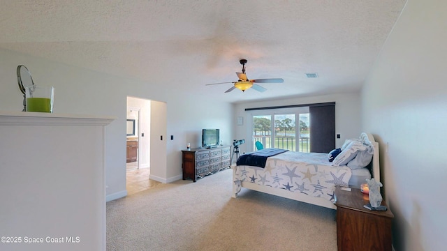 carpeted bedroom featuring ceiling fan, a textured ceiling, and access to outside