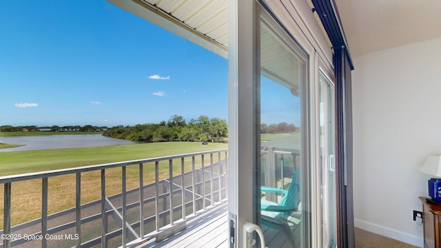 balcony featuring a water view