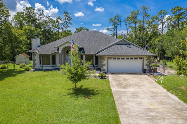 view of front of property with a garage and a front lawn