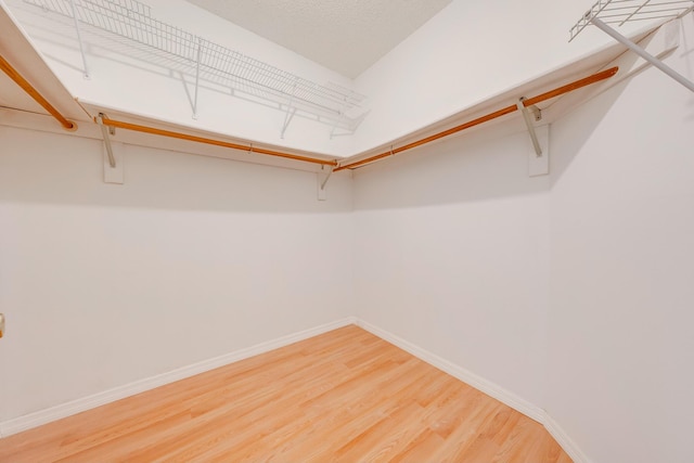 walk in closet featuring hardwood / wood-style floors