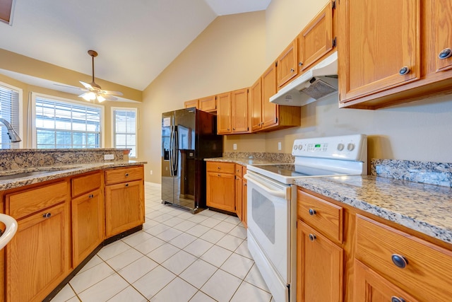 kitchen featuring white range with electric cooktop, sink, vaulted ceiling, ceiling fan, and black fridge with ice dispenser