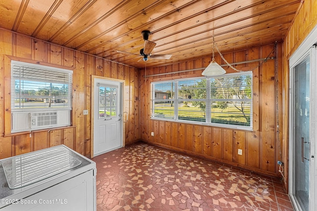 unfurnished sunroom with wooden ceiling, cooling unit, and ceiling fan