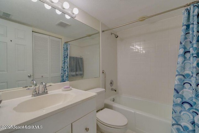 full bathroom with toilet, vanity, and shower / bath combination with curtain