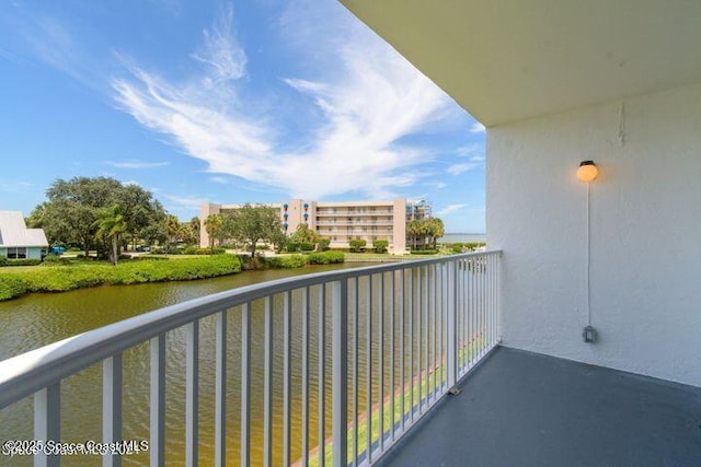 balcony featuring a water view