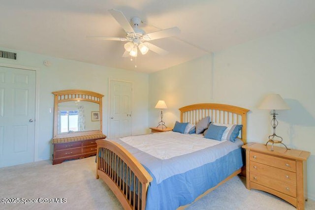 bedroom with ceiling fan and light colored carpet