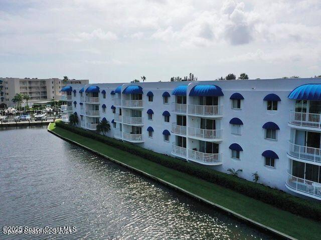 view of property with a water view