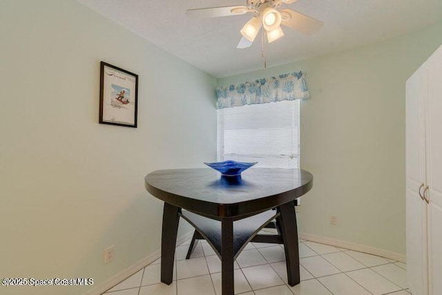 dining area featuring ceiling fan and light tile patterned floors