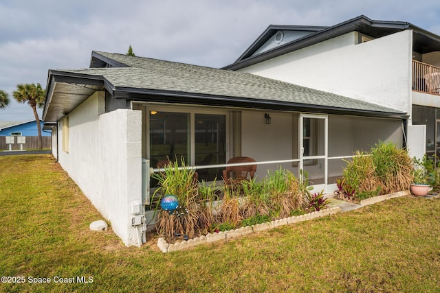 back of house featuring a yard