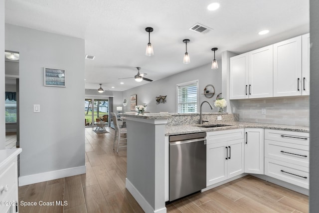 kitchen featuring sink, white cabinetry, dishwasher, and tasteful backsplash