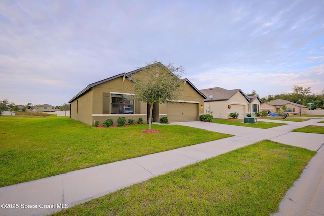 ranch-style home with a front lawn and a garage