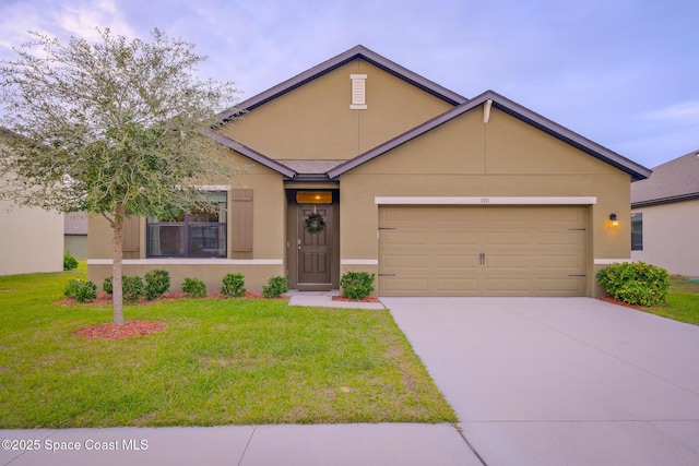 view of front of home with a garage and a front yard