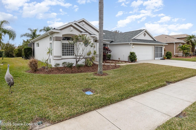 ranch-style home featuring a front lawn and a garage