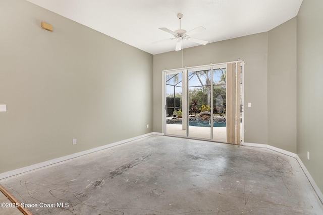 spare room featuring ceiling fan and concrete flooring