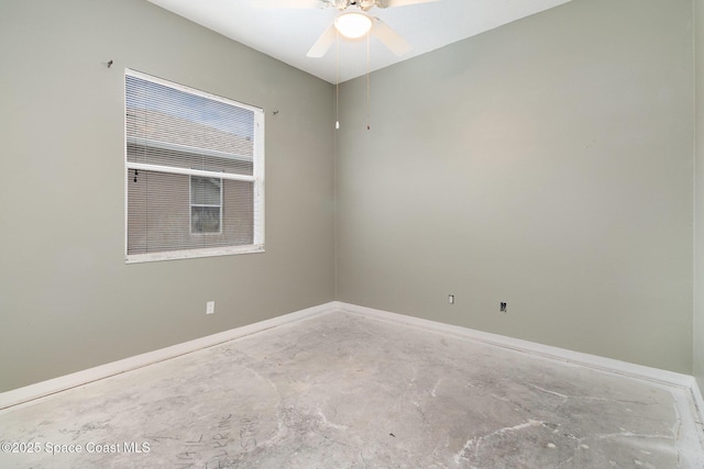 empty room featuring concrete floors and ceiling fan