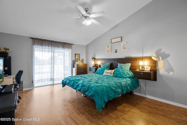 bedroom featuring ceiling fan, access to exterior, wood-type flooring, and lofted ceiling