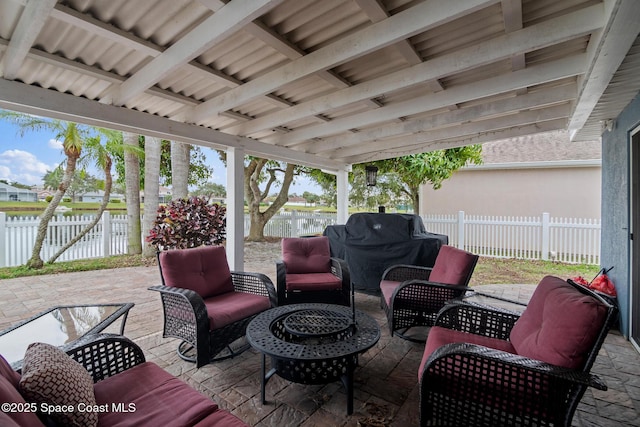 view of patio with a water view and an outdoor living space