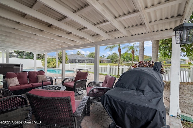 view of patio / terrace featuring a grill, outdoor lounge area, and a fenced in pool