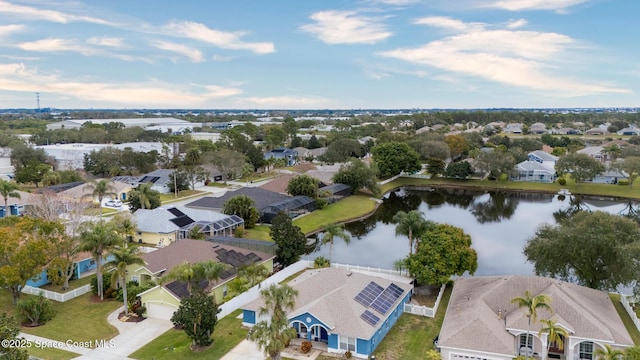 birds eye view of property with a residential view and a water view