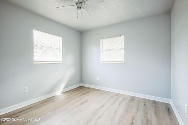 spare room featuring ceiling fan, a textured ceiling, and light hardwood / wood-style floors