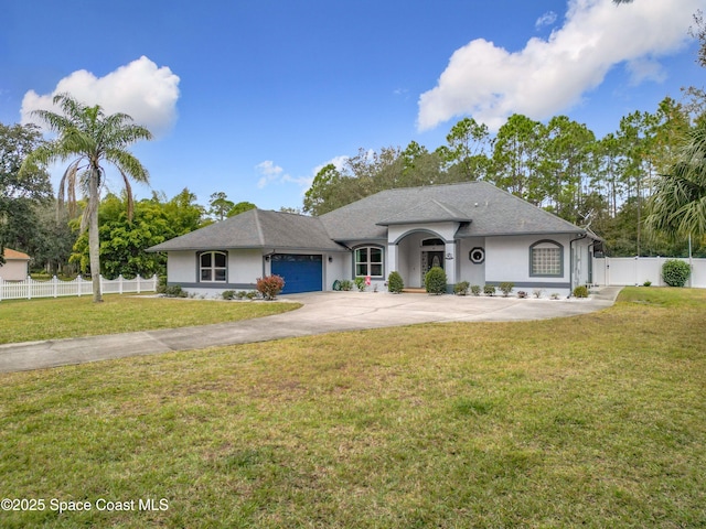 view of front of home featuring a front yard and a garage