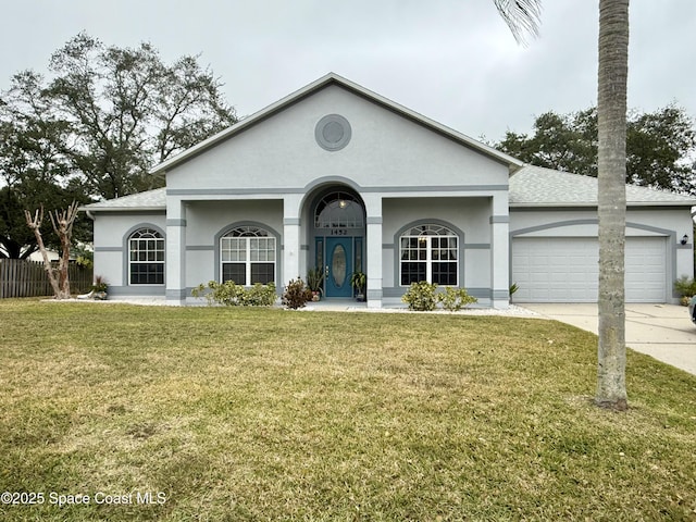 ranch-style house with a front yard and a garage