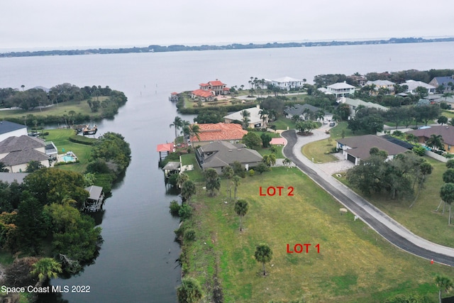 bird's eye view with a water view