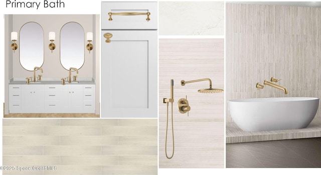 bathroom with a washtub, tile patterned floors, and vanity