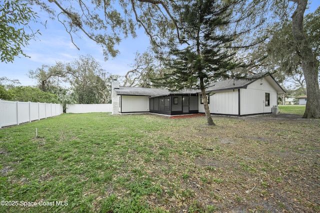 view of yard featuring a sunroom