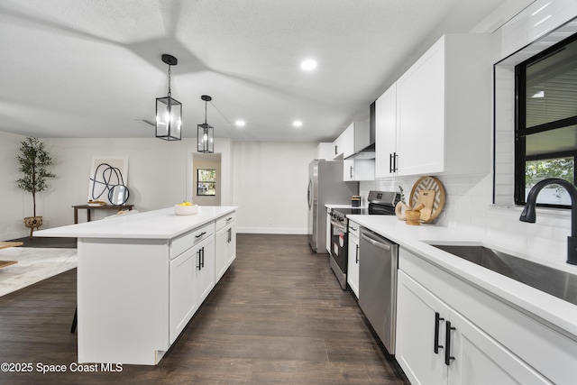 kitchen featuring decorative backsplash, sink, white cabinetry, and stainless steel appliances