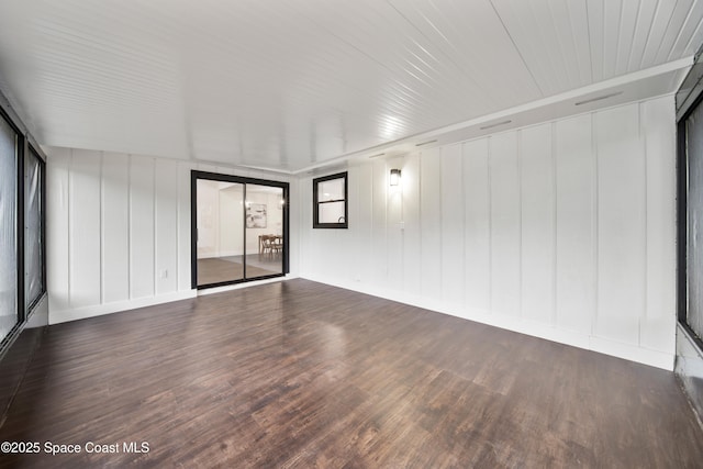 empty room with dark wood-type flooring