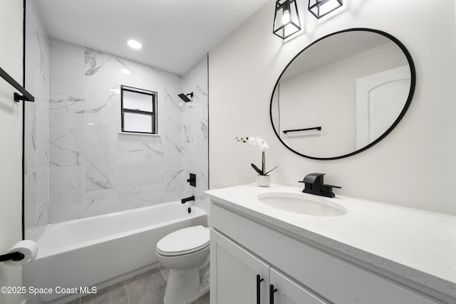 full bathroom featuring tiled shower / bath combo, vanity, toilet, and tile patterned flooring