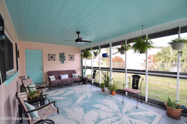 sunroom / solarium with ceiling fan