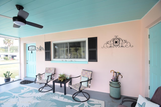 view of patio / terrace with ceiling fan and a porch