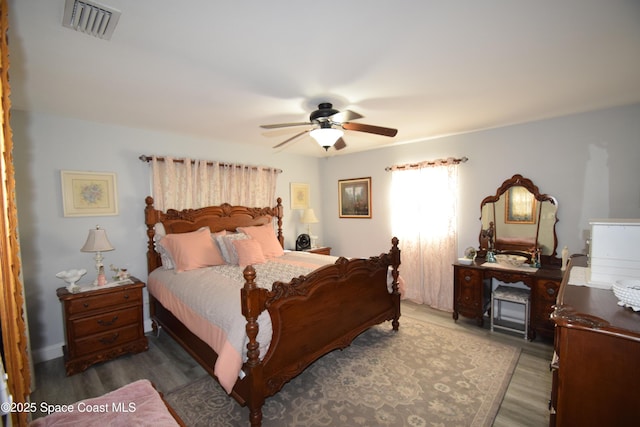 bedroom featuring ceiling fan and hardwood / wood-style floors