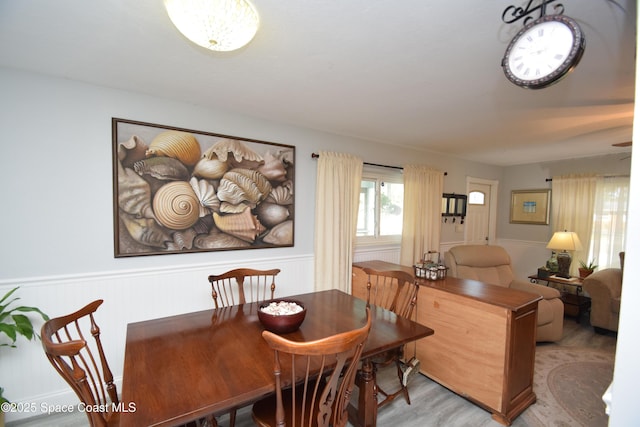 dining space with light hardwood / wood-style floors