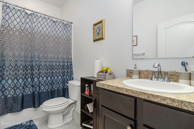 bathroom featuring toilet, vanity, a shower with curtain, and tile patterned flooring