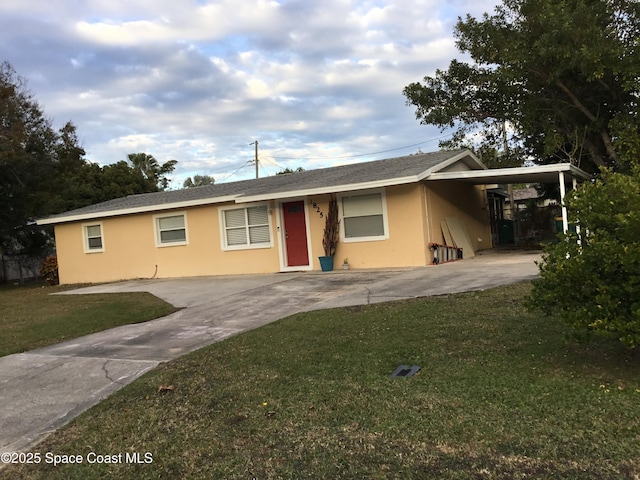 single story home featuring a front yard and a carport